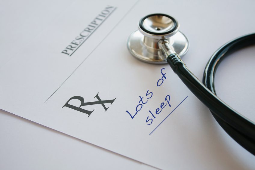 Prescription form lying on table with stethoscope